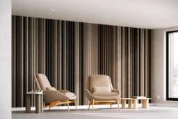 Die EASYfelt Lamella Wall in der Farbe Canyon bringt einen warmen, kraftvollen Ton in den Raum. Mit den zwei Stühlen vor der Wand entsteht ein harmonisches, einladendes Gesamtbild. Die Lamellen aus PET-Filz verbessern spürbar die Akustik und sorgen für eine moderne, hochwertige Wandgestaltung.